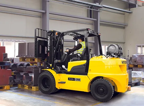 Operator Using Forklift to Move Equipment
